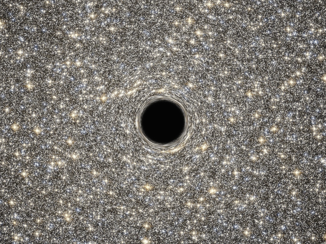 Representacao artistica de buraco negro supermassivo no centro de uma galaxia
